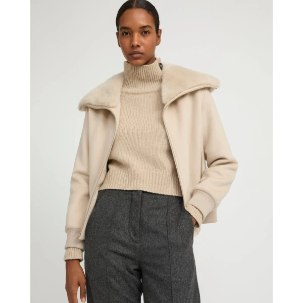 Woman wearing Yves Salomon shearling fur coat – luxury outerwear at Luxury Shoes 