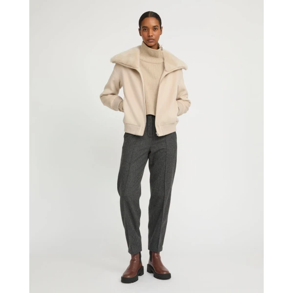 Woman wearing Yves Salomon shearling fur coat – luxury outerwear at Luxury Shoes 