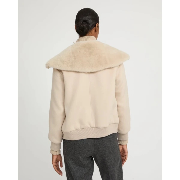 Woman wearing Yves Salomon shearling fur coat – luxury outerwear at Luxury Shoes 