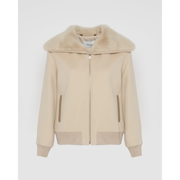 Woman wearing Yves Salomon shearling fur coat – luxury outerwear at Luxury Shoes 