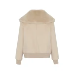 Woman wearing Yves Salomon shearling fur coat – luxury outerwear at Luxury Shoes 