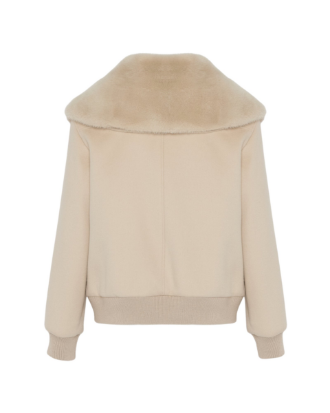 Woman wearing Yves Salomon shearling fur coat – luxury outerwear at Luxury Shoes 