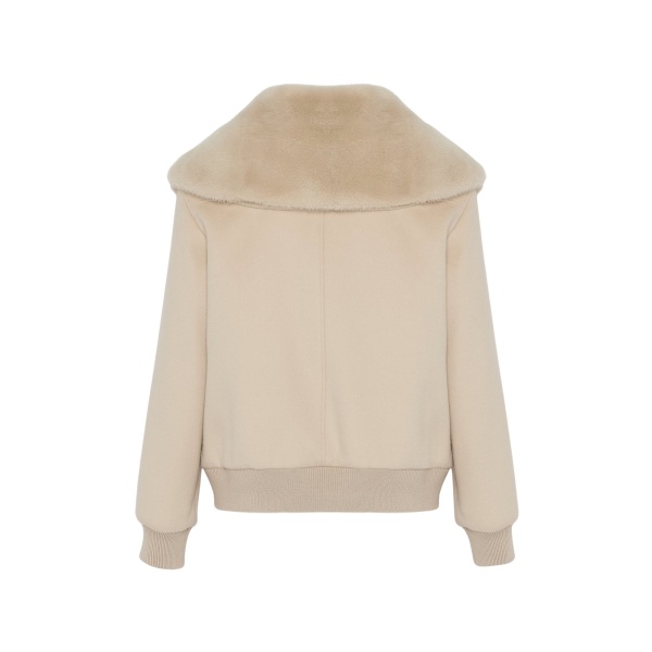 Woman wearing Yves Salomon shearling fur coat – luxury outerwear at Luxury Shoes 