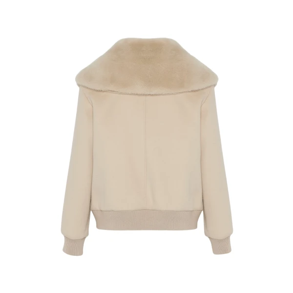 Woman wearing Yves Salomon shearling fur coat – luxury outerwear at Luxury Shoes 