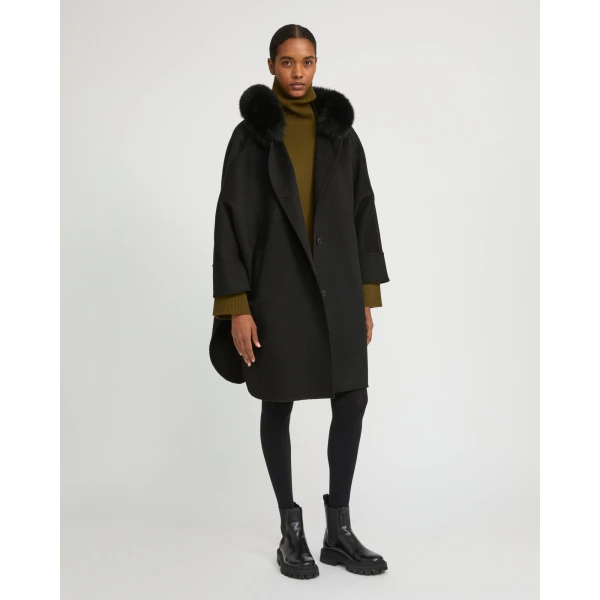 Woman wearing Yves Salomon shearling fur coat – luxury outerwear at Luxury Shoes 