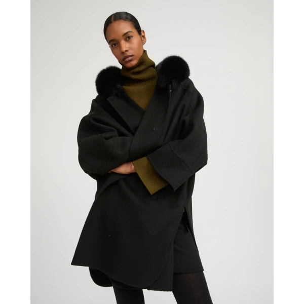 Woman wearing Yves Salomon shearling fur coat – luxury outerwear at Luxury Shoes 