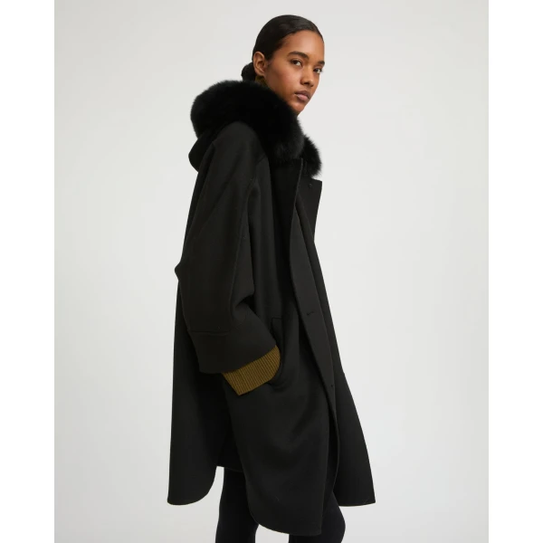 Woman wearing Yves Salomon shearling fur coat – luxury outerwear at Luxury Shoes 