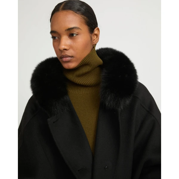 Woman wearing Yves Salomon shearling fur coat – luxury outerwear at Luxury Shoes 
