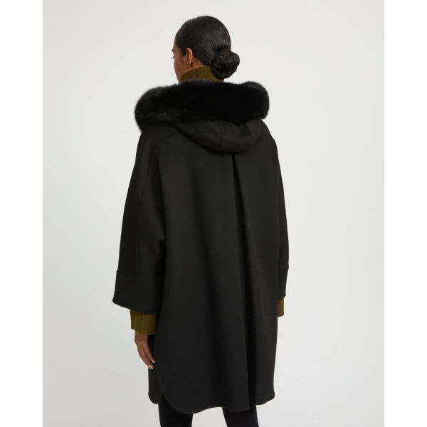 Woman wearing Yves Salomon shearling fur coat – luxury outerwear at Luxury Shoes 