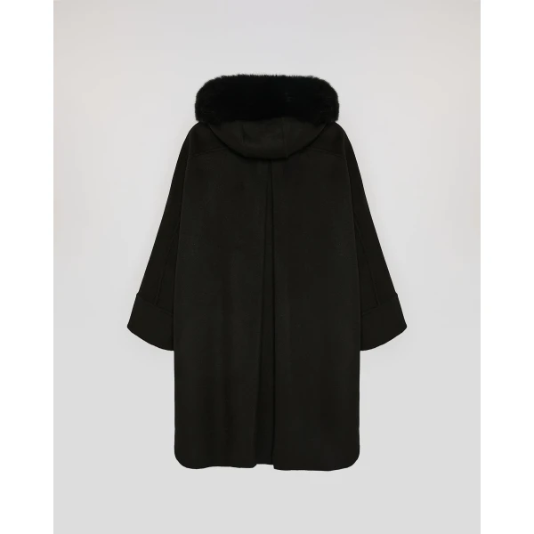 Woman wearing Yves Salomon shearling fur coat – luxury outerwear at Luxury Shoes 
