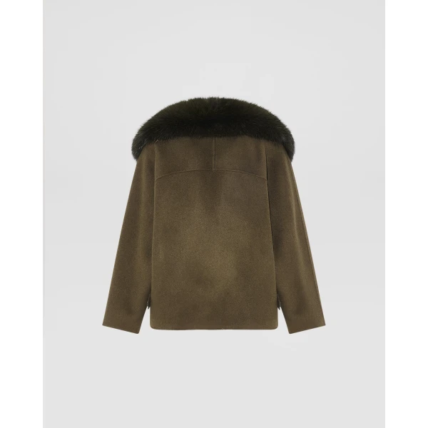 Woman wearing Yves Salomon shearling fur coat – luxury outerwear at Luxury Shoes 