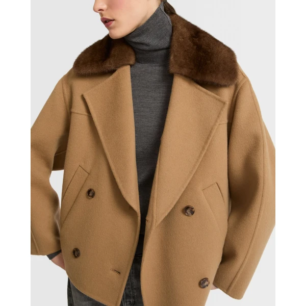 Woman wearing Yves Salomon shearling fur coat – luxury outerwear at Luxury Shoes 