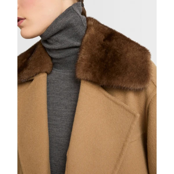 Woman wearing Yves Salomon shearling fur coat – luxury outerwear at Luxury Shoes 