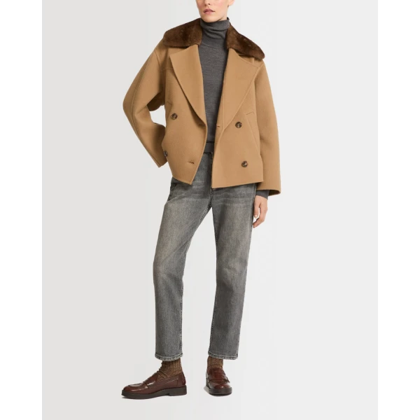 Woman wearing Yves Salomon shearling fur coat – luxury outerwear at Luxury Shoes 
