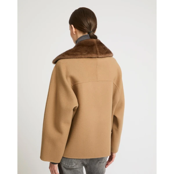 Woman wearing Yves Salomon shearling fur coat – luxury outerwear at Luxury Shoes 