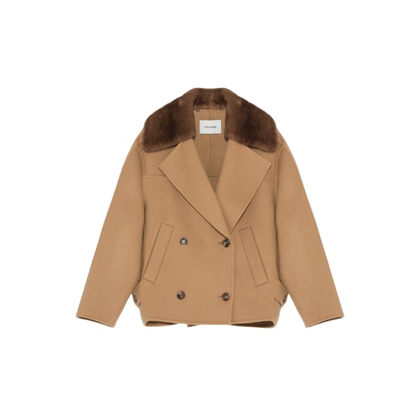 Woman wearing Yves Salomon shearling fur coat – luxury outerwear at Luxury Shoes 