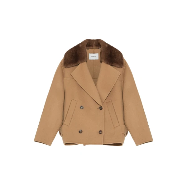 Woman wearing Yves Salomon shearling fur coat – luxury outerwear at Luxury Shoes 