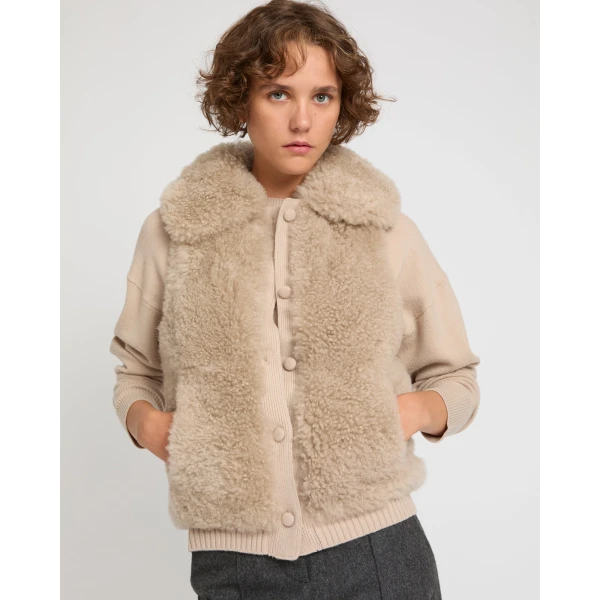 Woman wearing Yves Salomon shearling fur coat – luxury outerwear at Luxury Shoes 