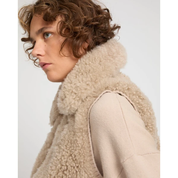 Woman wearing Yves Salomon shearling fur coat – luxury outerwear at Luxury Shoes 