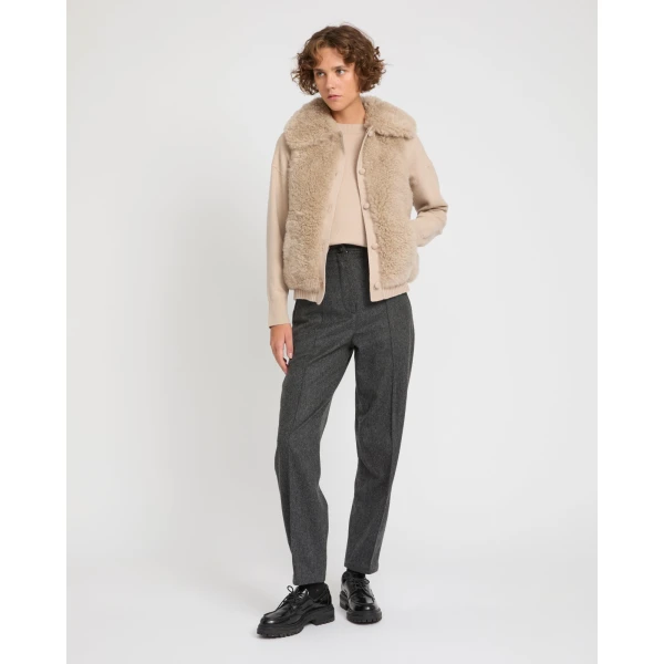 Woman wearing Yves Salomon shearling fur coat – luxury outerwear at Luxury Shoes 