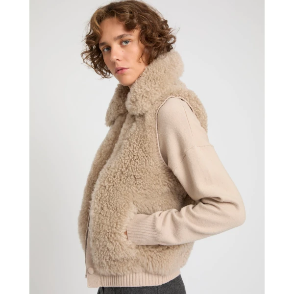 Woman wearing Yves Salomon shearling fur coat – luxury outerwear at Luxury Shoes 