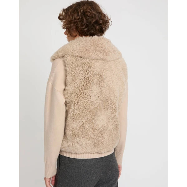 Woman wearing Yves Salomon shearling fur coat – luxury outerwear at Luxury Shoes 