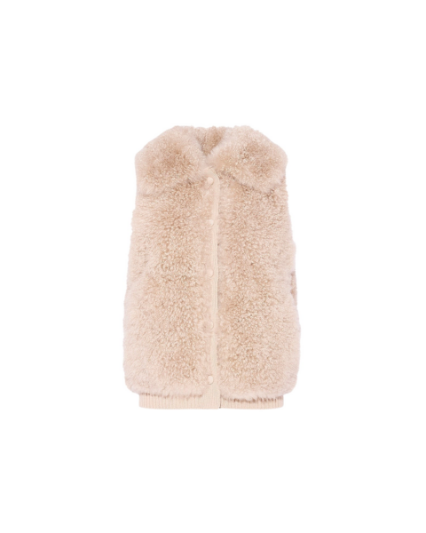 Woman wearing Yves Salomon shearling fur coat – luxury outerwear at Luxury Shoes 