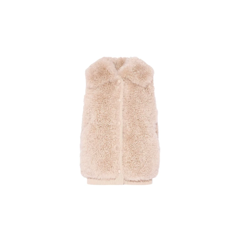 Woman wearing Yves Salomon shearling fur coat – luxury outerwear at Luxury Shoes 