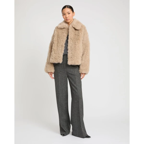 Woman wearing Yves Salomon shearling fur coat – luxury outerwear at Luxury Shoes 