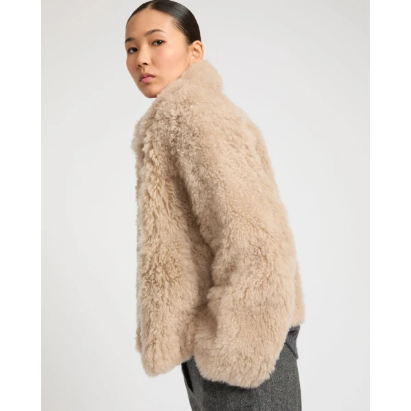 Woman wearing Yves Salomon shearling fur coat – luxury outerwear at Luxury Shoes 