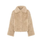 Woman wearing Yves Salomon shearling fur coat – luxury outerwear at Luxury Shoes 