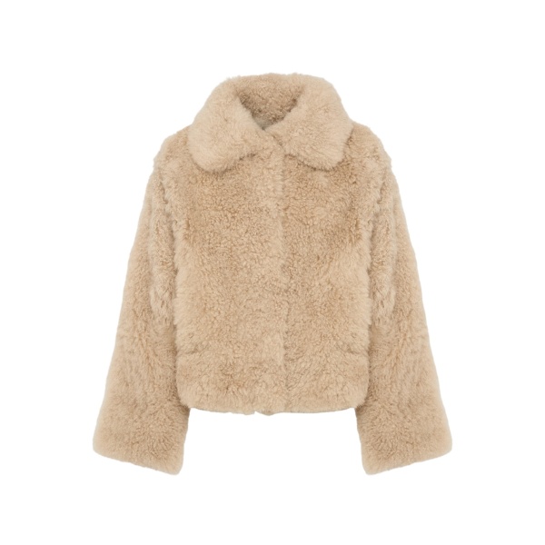 Woman wearing Yves Salomon shearling fur coat – luxury outerwear at Luxury Shoes 