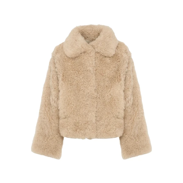 Woman wearing Yves Salomon shearling fur coat – luxury outerwear at Luxury Shoes 