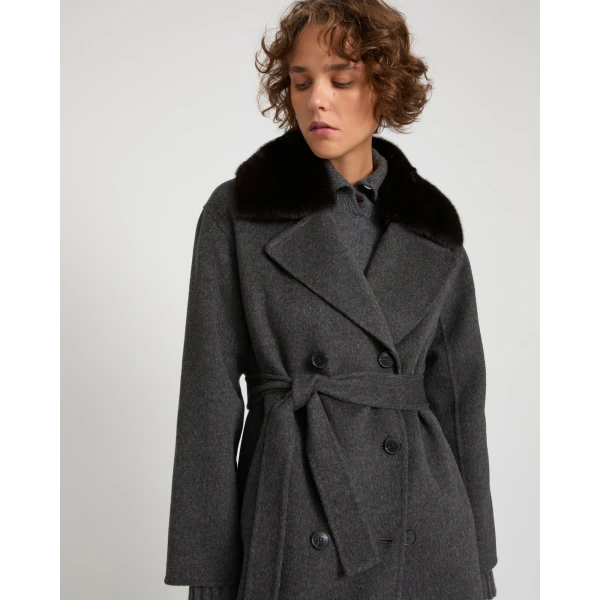 Woman wearing Yves Salomon shearling fur coat – luxury outerwear at Luxury Shoes 