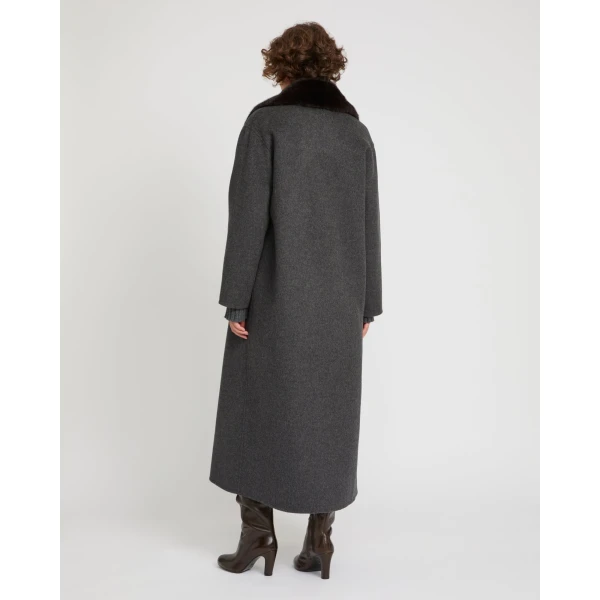 Woman wearing Yves Salomon shearling fur coat – luxury outerwear at Luxury Shoes 