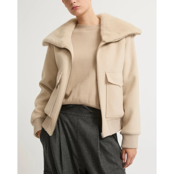 Woman wearing Yves Salomon shearling fur coat – luxury outerwear at Luxury Shoes 