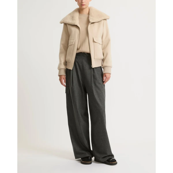 Woman wearing Yves Salomon shearling fur coat – luxury outerwear at Luxury Shoes 