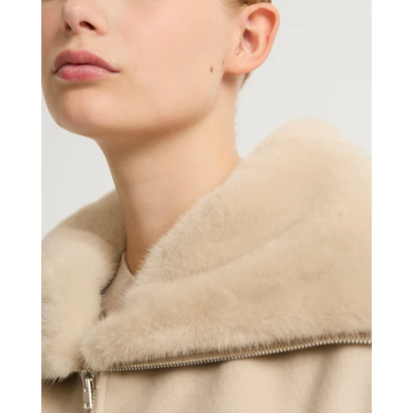 Woman wearing Yves Salomon shearling fur coat – luxury outerwear at Luxury Shoes 