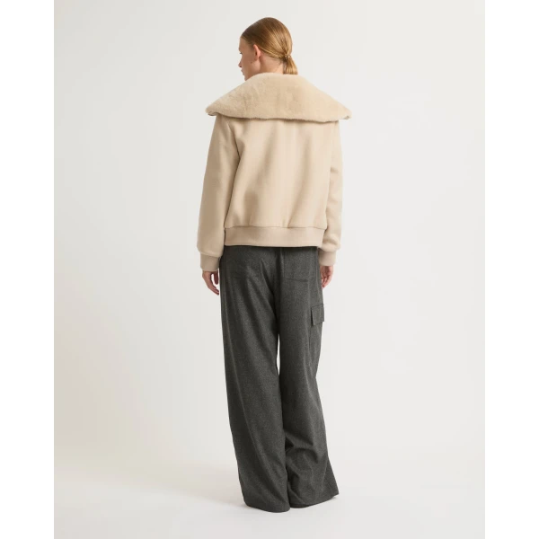 Woman wearing Yves Salomon shearling fur coat – luxury outerwear at Luxury Shoes 