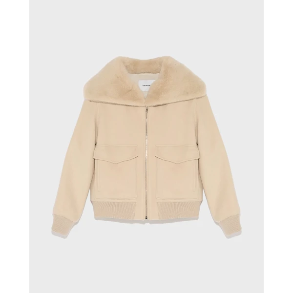 Woman wearing Yves Salomon shearling fur coat – luxury outerwear at Luxury Shoes 