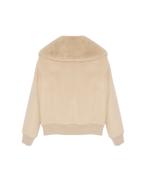 Woman wearing Yves Salomon shearling fur coat – luxury outerwear at Luxury Shoes 