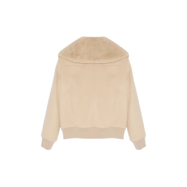 Woman wearing Yves Salomon shearling fur coat – luxury outerwear at Luxury Shoes 