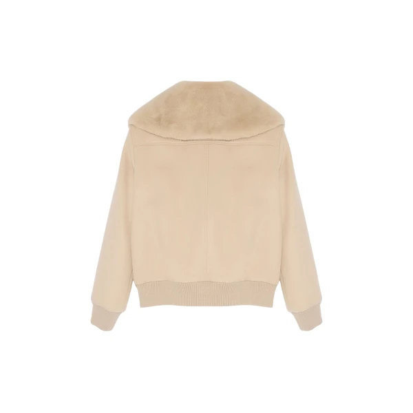 Woman wearing Yves Salomon shearling fur coat – luxury outerwear at Luxury Shoes 