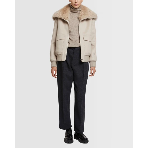 Woman wearing Yves Salomon shearling fur coat – luxury outerwear at Luxury Shoes 
