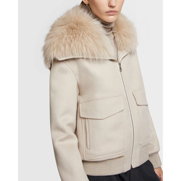 Woman wearing Yves Salomon shearling fur coat – luxury outerwear at Luxury Shoes 