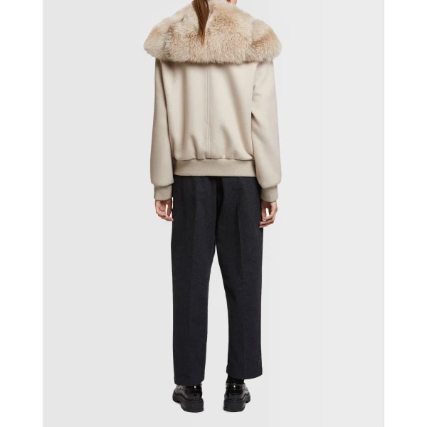 Woman wearing Yves Salomon shearling fur coat – luxury outerwear at Luxury Shoes 