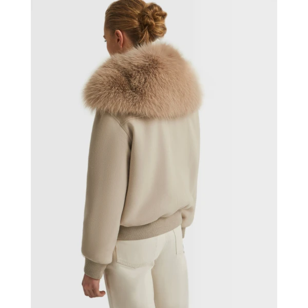 Woman wearing Yves Salomon shearling fur coat – luxury outerwear at Luxury Shoes 