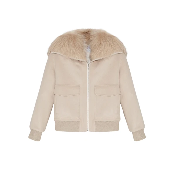 Woman wearing Yves Salomon shearling fur coat – luxury outerwear at Luxury Shoes 