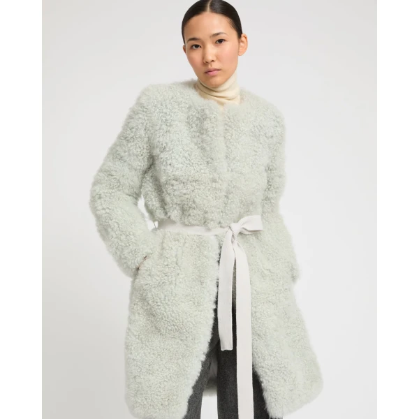 Woman wearing Yves Salomon shearling fur coat – luxury outerwear at Luxury Shoes 