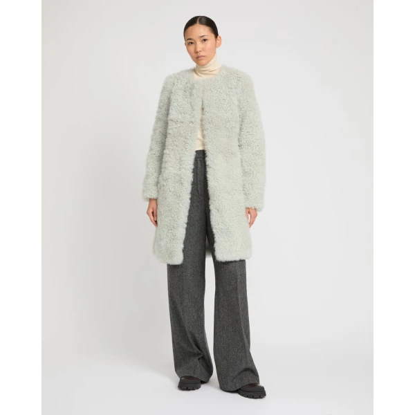 Woman wearing Yves Salomon shearling fur coat – luxury outerwear at Luxury Shoes 